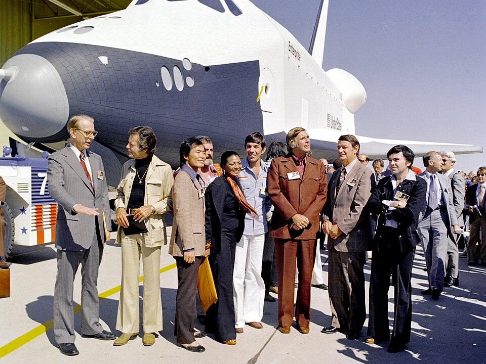 Enterprise with Star Trek cast members.