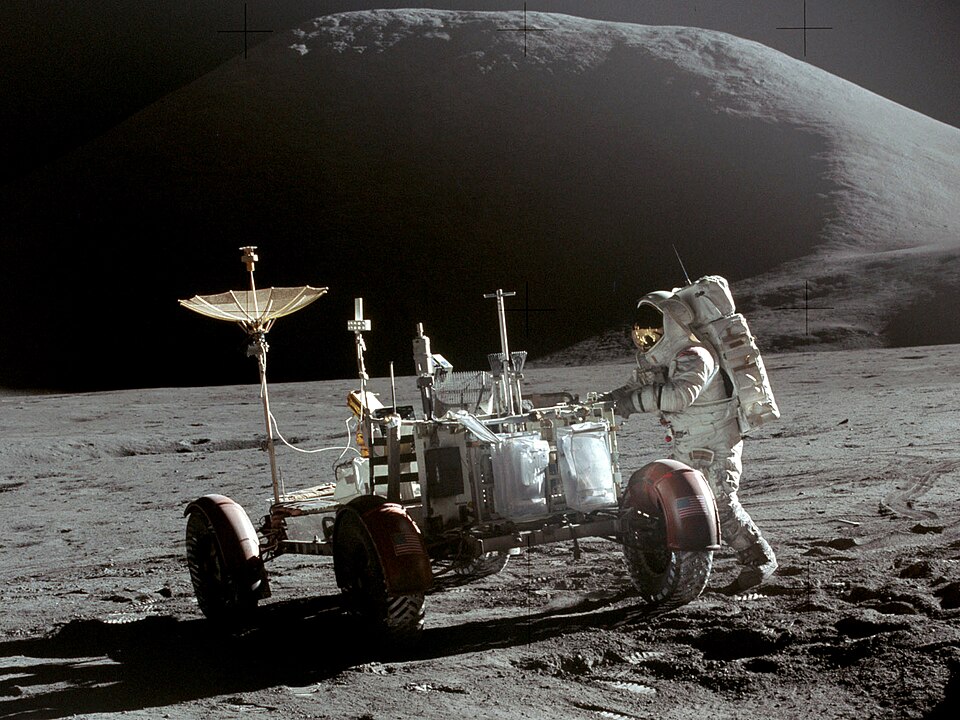 Lunar Module Pilot Jim Irwin is seen with the Lunar Roving Vehicle